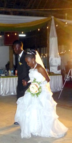 Bride and Groom dance their way to the stage. 